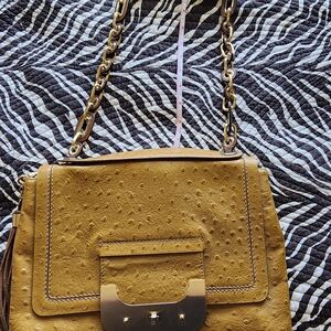 Elegant Tan Embossed Clutch with Tassel